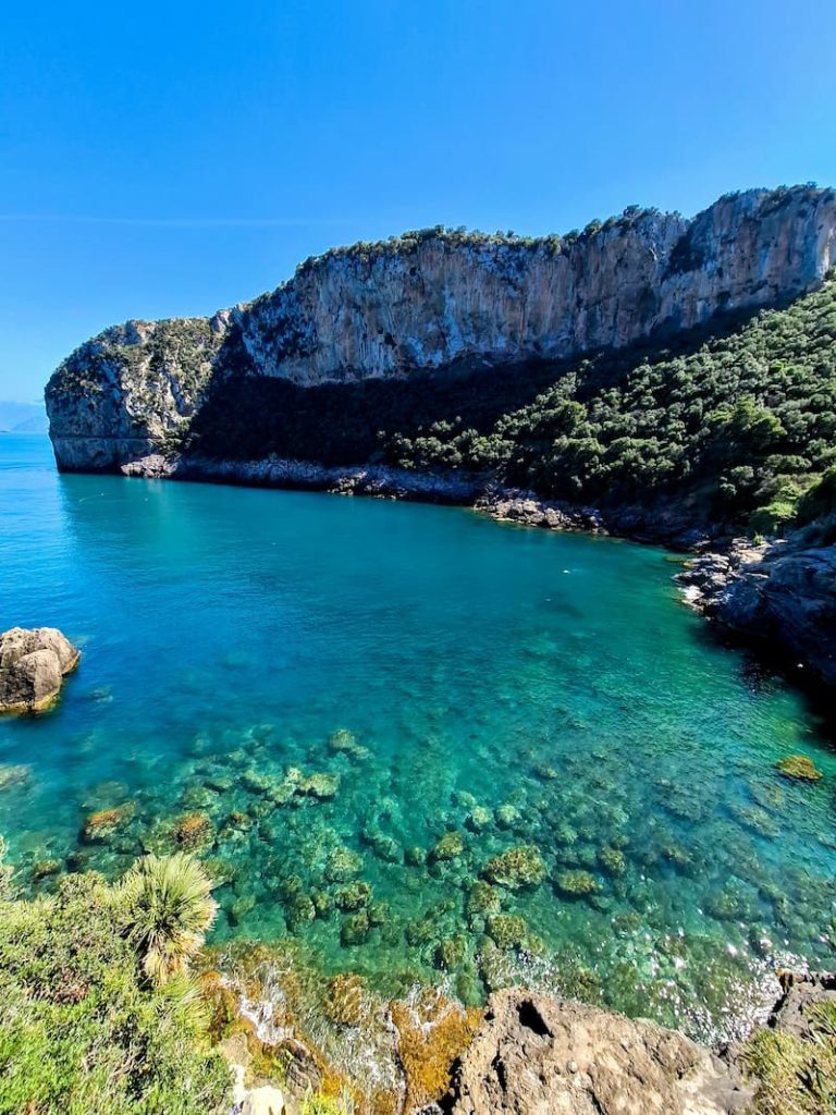 My Summer 10-Day Secret Italy Itinerary: Hidden Beaches & Island Bliss the emerald waters of Baia degli Infreschi, Cilento, Southern Italy.